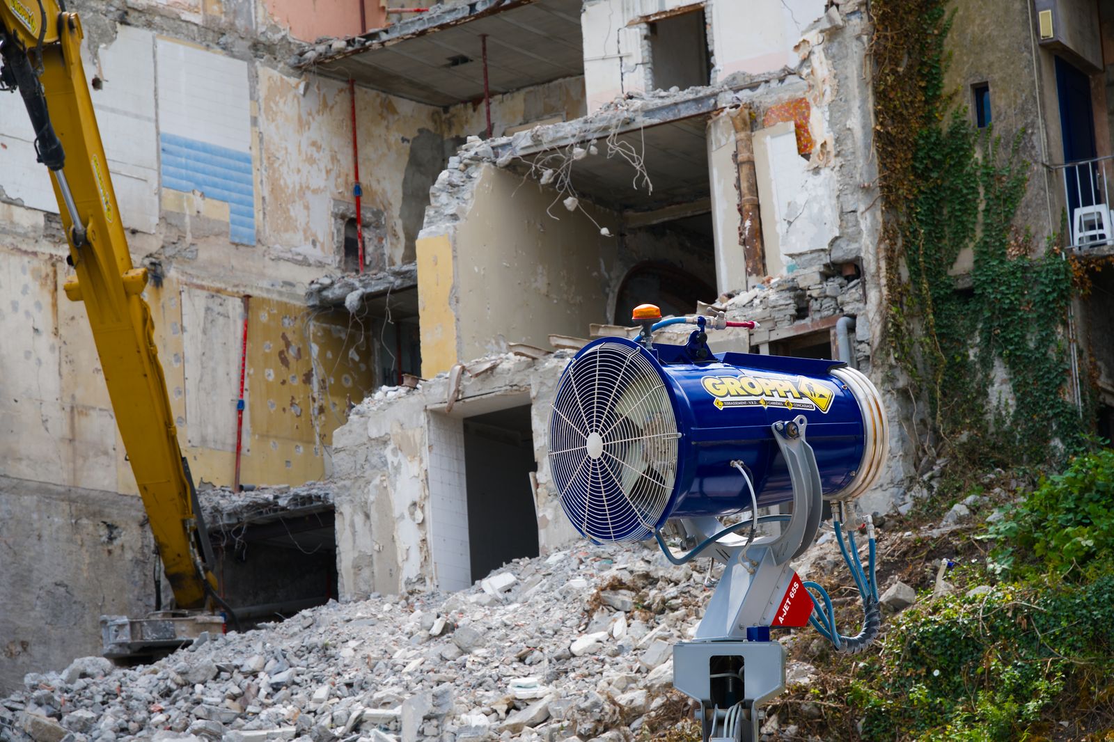 Excavator working a demolition site